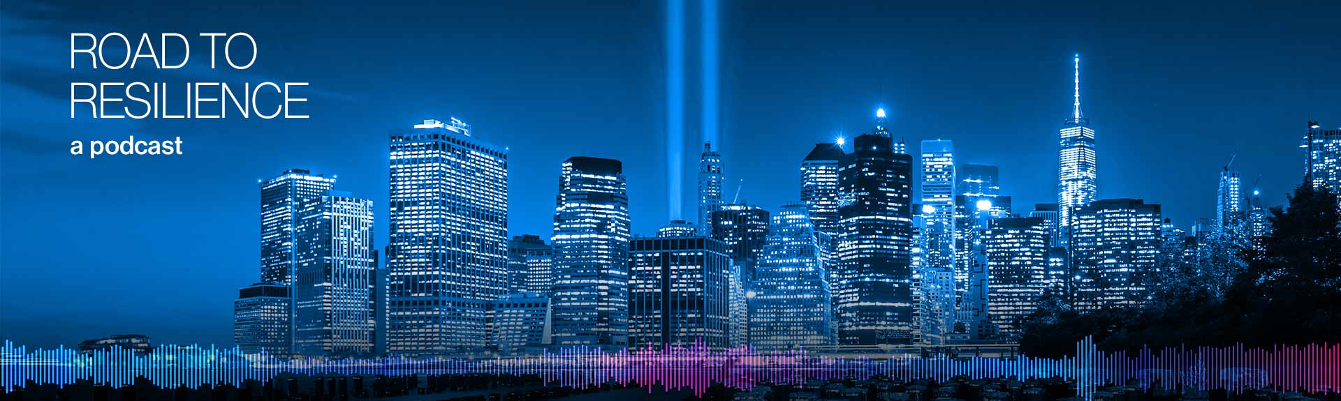 image of cityscape with 9/11 memorial lights in projecting to the sky